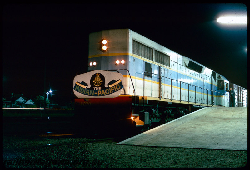 T06409
L Class 270, long-end leading, Indian Pacific, headboard, Perth Terminal, East Perth, Commonwealth Railways VDM Class 1350 goods van, platform, night photo
