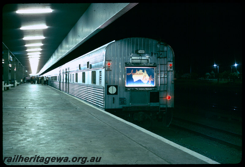 T06411
Indian Pacific consist, Perth Terminal, East Perth, illuminated name board on rear of train, red marker lights, platform, night photo
