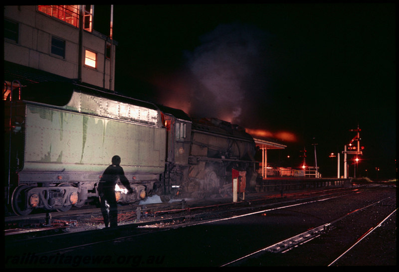 T06504
V Class 1217, Brunswick Junction, station building, signal cabin, platform, semaphore signals, night photo
