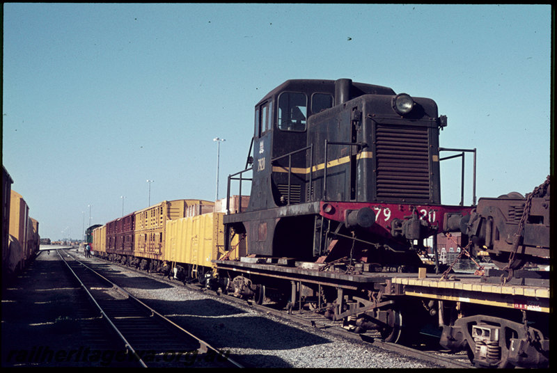 T06858
Ex-NSWGR 79 Class 7920, loaded on QCE Class 23594 flat wagon, bogies loaded onto adjoining flat wagon, train being shunted by MA Class 1861, Forrestfield, 79 Class bound for Geraldton to be shipped to British Phosphate Commissioners on Christmas Island
