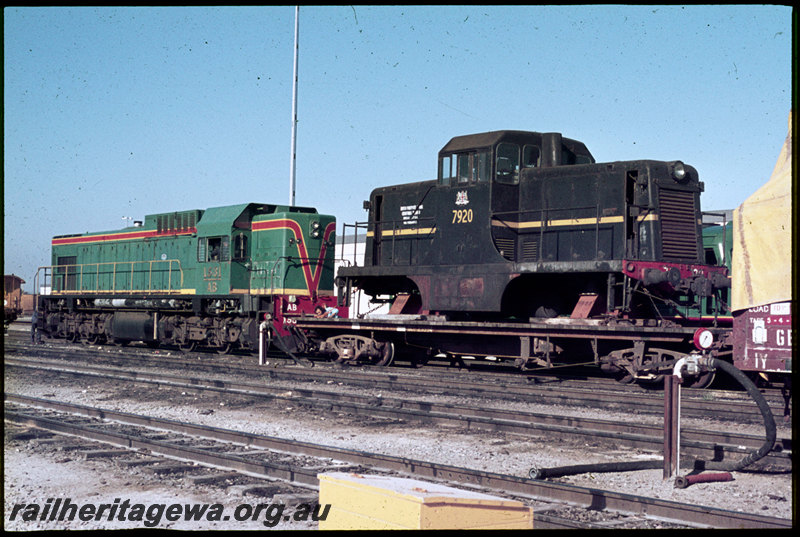 T06865
AB Class 1531, ex-NSWGR 79 Class 7920 loaded on QCE Class 23594 flat wagon in consist, shunters float, Forrestfield, 79 Class bound for Geraldton to be shipped to British Phosphate Commissioners on Christmas Island, ground shunt signal, vacuum brake test stand
