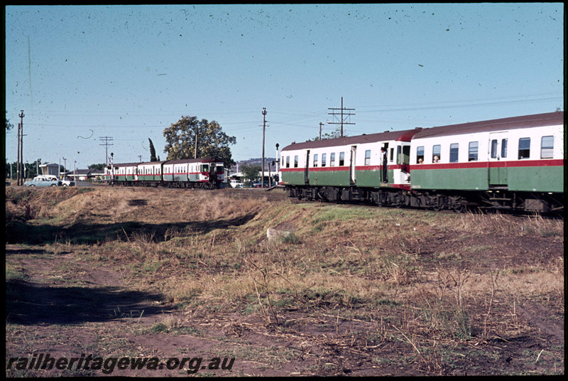 T06895
ADG/ADA Class railcar set, Up suburban passenger service, ADG/AYE/ADG Class railcar set, Down suburban passenger service, both trains arriving at Stokely, Albany Highway level crossing, SWR line
