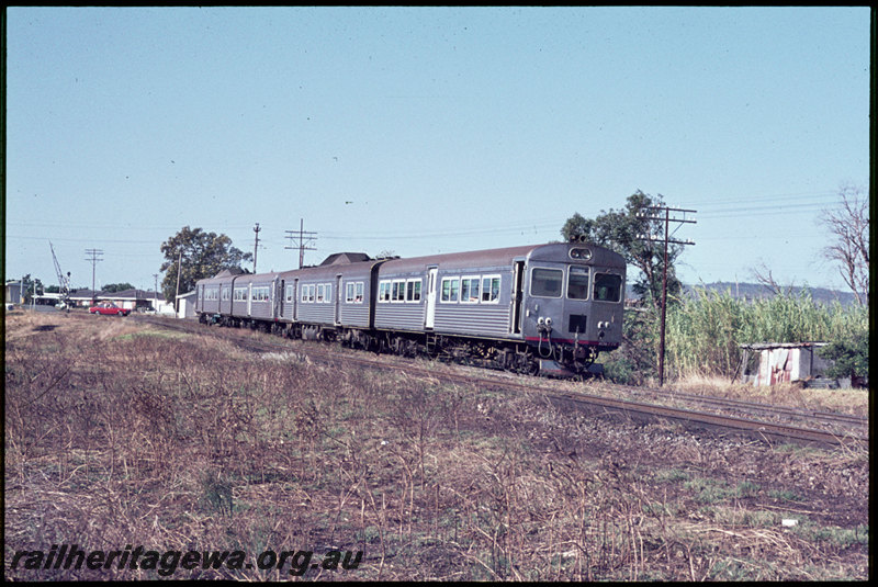 T06902
ADB Class 772 leading ADK/ADB/ADK Class railcar set, Down suburban passenger service, departing Stokely, Albany Highway level crossing, SWR line
