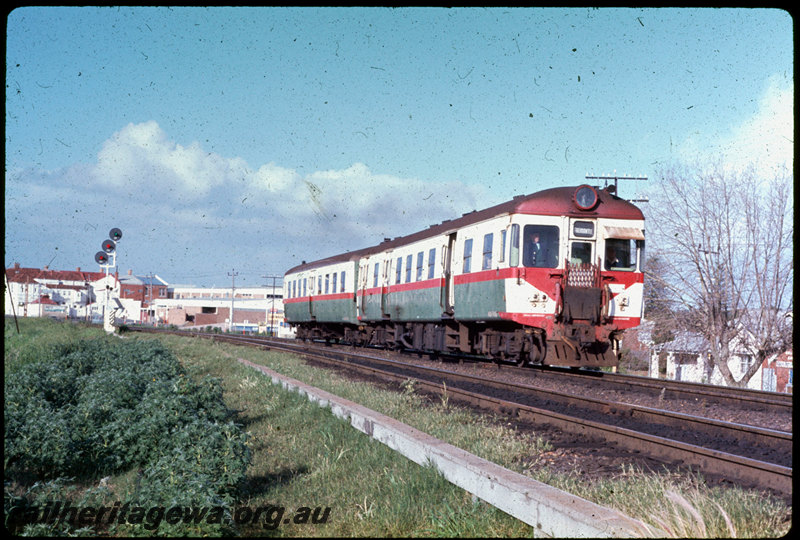 T06984
ADG/ADA Class railcar set, Up suburban passenger service, departing Claremont, searchlight signal, ER line

