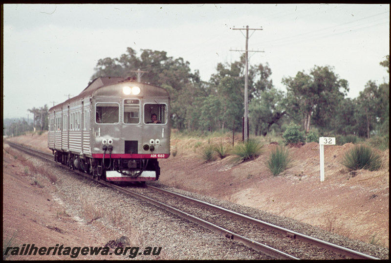T07141
ADK Class 682 railcar with ADB Class trailer, Up suburban passenger service, between Byford and Armadale, 32 kilometre peg, ER line

