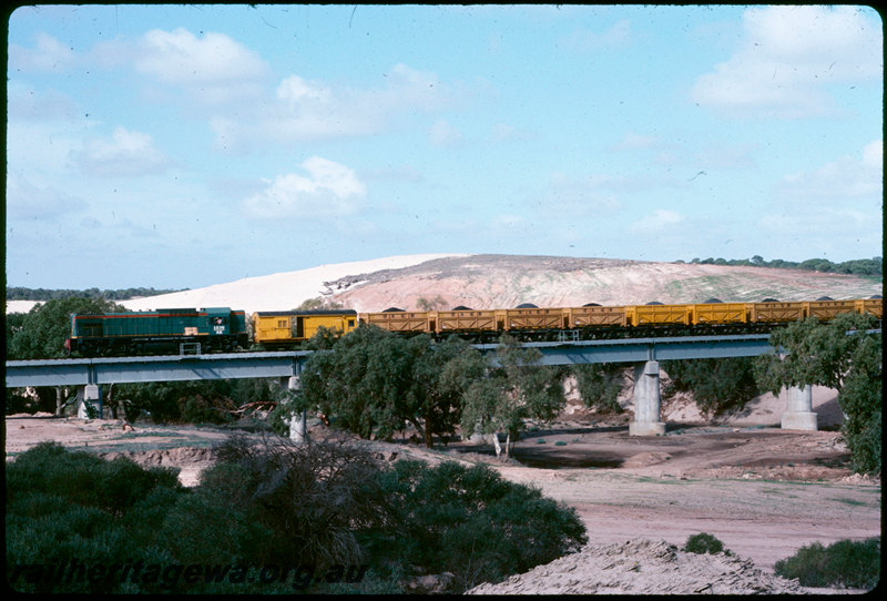 T07161
AB Class 1536, loaded mineral sands train, ilmenite containers, QW Class wagons converted from ex-W Class steam locomotive tender underframes, Irwin River Bridge, between Eneabba and Dongara, DE line
