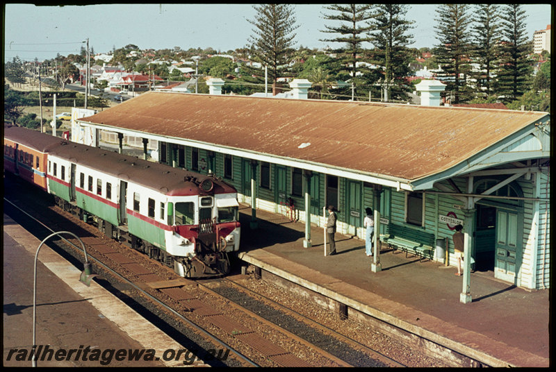 T07208
ADX Class 670 with ADA/ADX Class railcar set, Up suburban passenger service, Cottesloe, station building, platform, station sign, note stainless steel cowcatcher on ADX railcar, ER line
