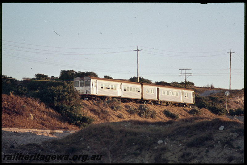 T07224
ADB/ADK Class railcar set, Down suburban passenger service, between Leighton and Victoria Street, freight line from Leighton Yard to Cottesloe in cutting in foreground, searchlight signal, ER line
