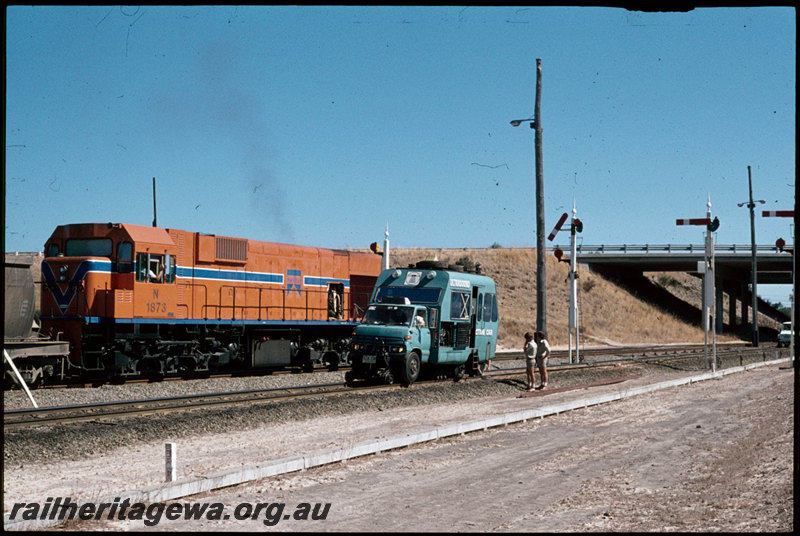 T07272
N Class 1873, loaded bauxite train, Plasser Ultrasound Detection Car, Kwinana, Rockingham Road overpass, semaphore signals, FM line
