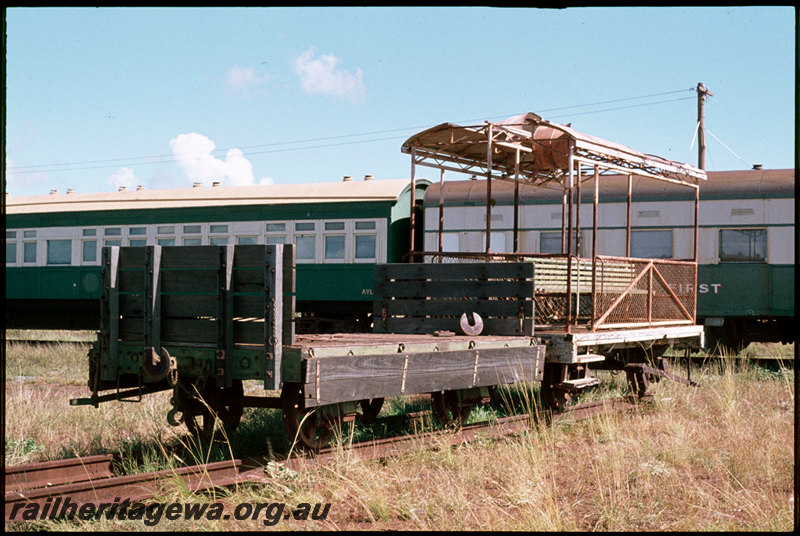 T07292
H Class low-sided wagon and open toast-rack style carriage, both ex-Public Works Department, Point Samson Jetty, ex-WAGR carriages AYL Class 29 and AH Class 565, preserved at Pilbara Railway Historical Society, Six Mile Museum, Dampier
