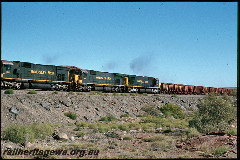 T07298
Hamersley Iron ALCos C636 3016, M636 4038 and another unidentified M636 loco, empty iron ore train, near Western Creek, Pilbara
