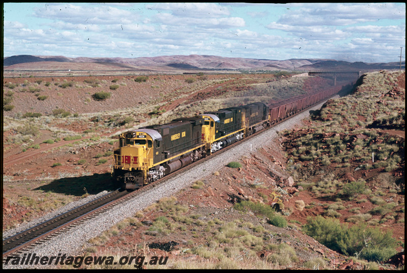 T07300
Hamersley Iron ALCos M636 4031, C636 3010 and C628 2005, loaded train iron ore train, passing under Robe River line, Western Creek, Pilbara
