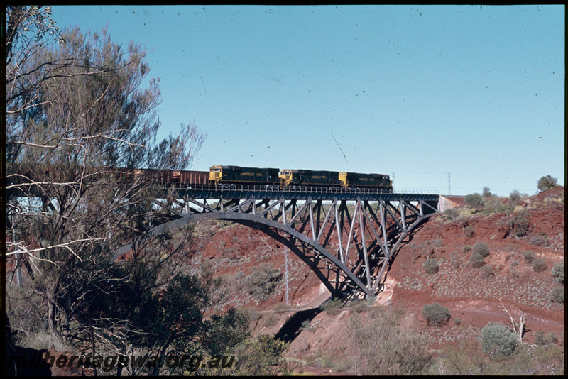T07307
Hamersley Iron unidentified M636 ALCos, empty iron ore train, Spring Creek Bridge, steel arch bridge, Pilbara
