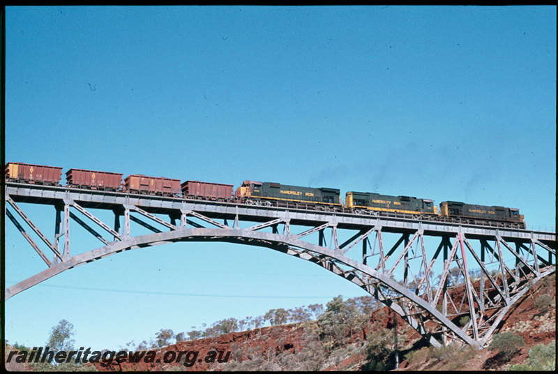 T07308
Hamersley Iron unidentifed M636, C636 and M636 ALCos, empty iron ore train, Spring Creek Bridge, steel arch bridge, Pilbara

