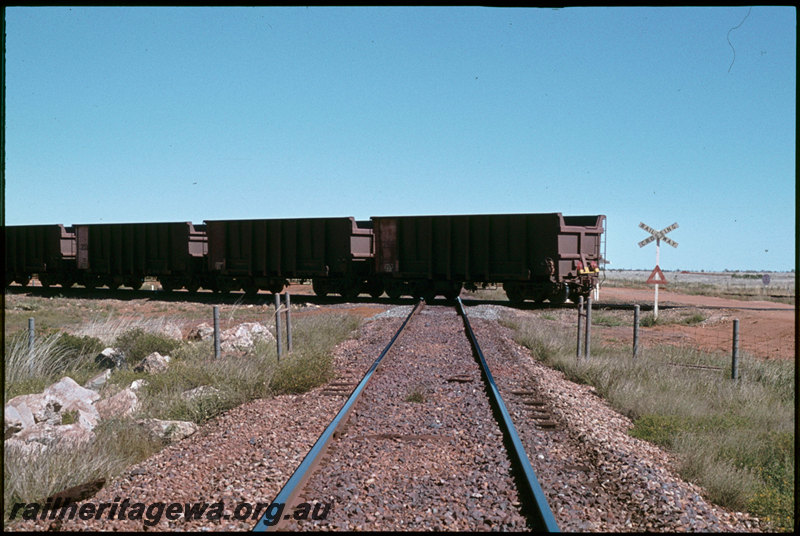 T07311
Rear of Mount Newman Mining empty iron ore train, Newgold Crossing, Mount Newman Railway at-grade crossing with Goldsworthy Railway, near Port Hedland, Pilbara
