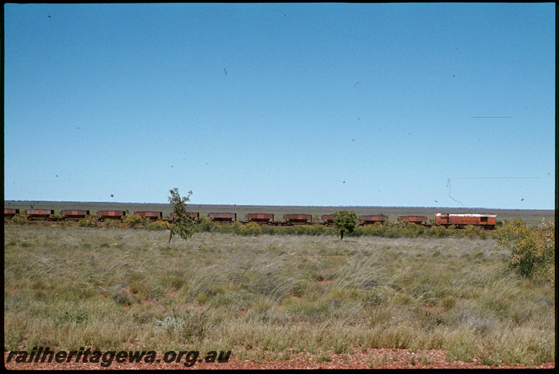 T07315
Unidentified Goldsworthy Mining A Class, locomotive built to the same design as the Western Australian Government Railways K class, loaded iron ore train, between Mount Goldsworthy and Port Hedland, Pilbara
