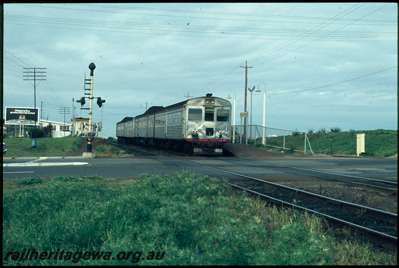 T07414
ADB Class 771 with ADK/ADB/ADK Class railcar set, Down suburban passenger service, Victoria Street, station sign, platform, shelter, level crossing, ER line
