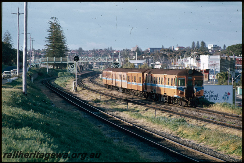 T07419
ADG/AYE/ADG/ADA Class railcar set, Up suburban passenger service, departing Mosman Park, platform, footbridge, searchlight signal, freight line from Leighton Yard to Cottesloe in foreground, ER line
