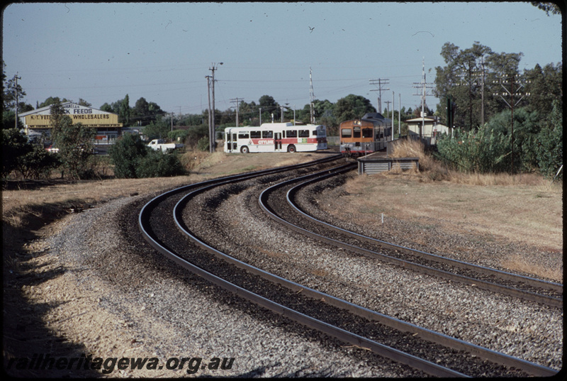 T08364
ADB Class 775 with ADK Class railcar, Down suburban passenger service, Stokley, Albany Highway level crossing, platform, station shelter, SWR line
